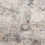 Close up of the Braddyville Area Rug showing its black, brown, gray, and cream contemporary pattern. Swatch