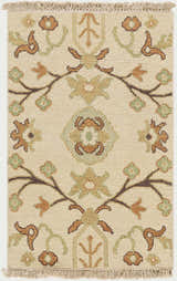 Close-up of the Brentford Carpet. Hand-knotted wool rug with a farmhouse style floral pattern in oatmeal, brown, and olive. Design-Rectangle-23