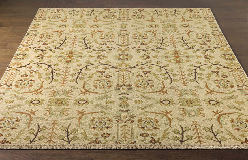 Close-up of the hand-knotted Brentford Carpet. Features a traditional floral and branch pattern in oatmeal, olive, brown, and tan. Front