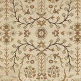Close-up of the Brentford Carpet, a hand-knotted rug with a traditional floral pattern in brown, tan, and oatmeal tones. Swatch
