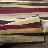 Close-up of Brevard Striped Area Rug featuring beige, brown, red, sage, and gray stripes. Machine woven texture. Contemporary style. Fold