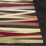 Close-up of the Brevard Striped Area Rug showing beige, brown, red, and gray stripes on dark wood floors. Front