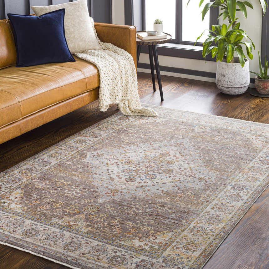 Living room scene with a brick red Bourget Area Carpet, leather couch, and plants. Bohemian style. Roomscene-Rectangle
