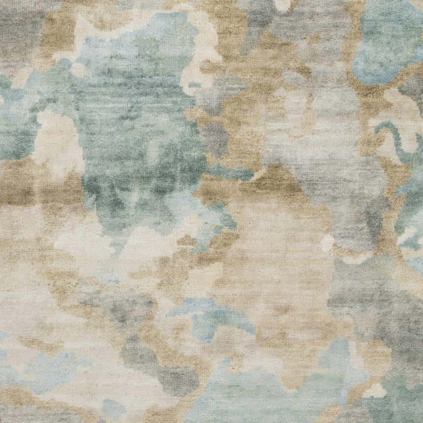Close-up of the Briceville Premium Area Rug. Hand-knotted wool rug in ivory, medium green, pale blue, peach, and wheat. Texture