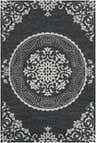 Close-up of the Boronia Clearance Rug. Hand-hooked polypropylene rug in black and light beige with an ornate, traditional floral pattern. Design-Rectangle-58