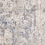 Close-up of the Broxbourne Area Rug, a contemporary design in blush, brown, cream, and navy. Abstract pattern and soft texture. Swatch
