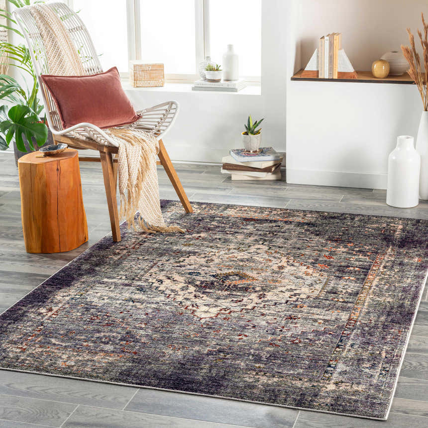 Living room scene with Basiad Washable Area Rug in blush, purple, and gray tones. Farmhouse style with modern chair and wood accents. Roomscene-Rectangle