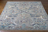 Detailed view of the hand-knotted Bugasan Area Rug. Gray, teal, plum, and brown tones. Bohemian style. Front