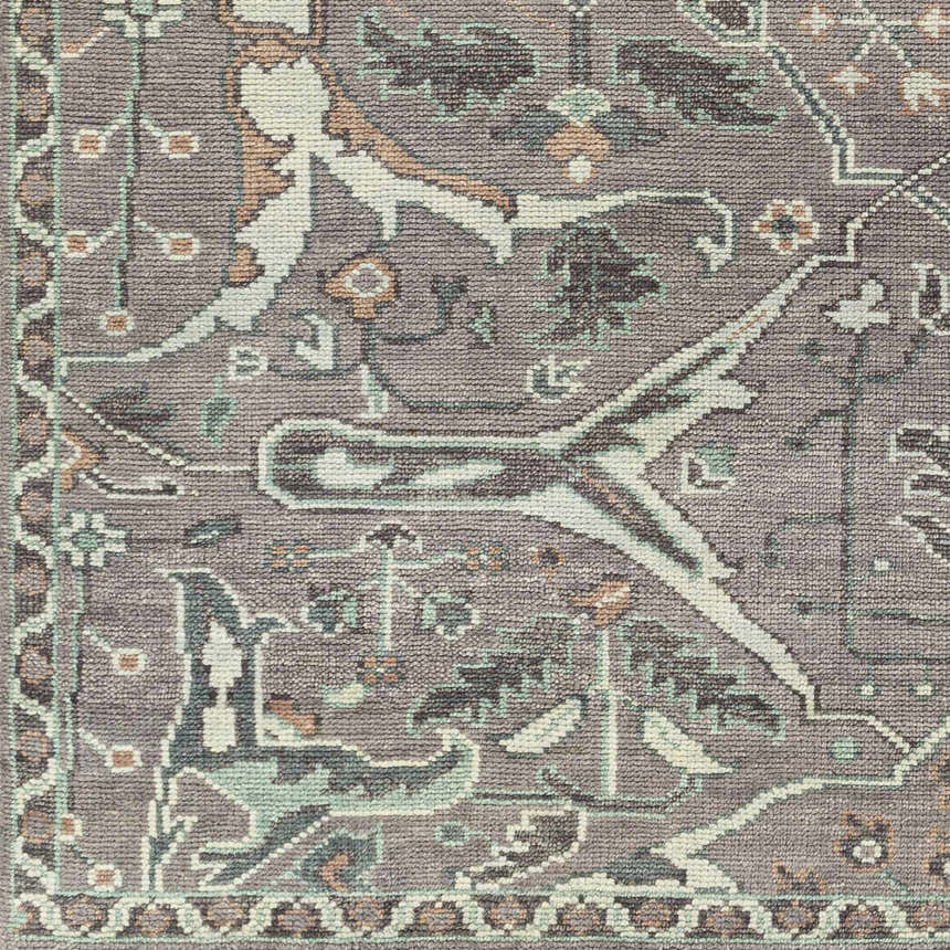 Close-up of the hand-knotted Bugasan Area Rug. Plum, tan, teal, and gray tones in a traditional Oriental pattern. 100% wool texture. Swatch