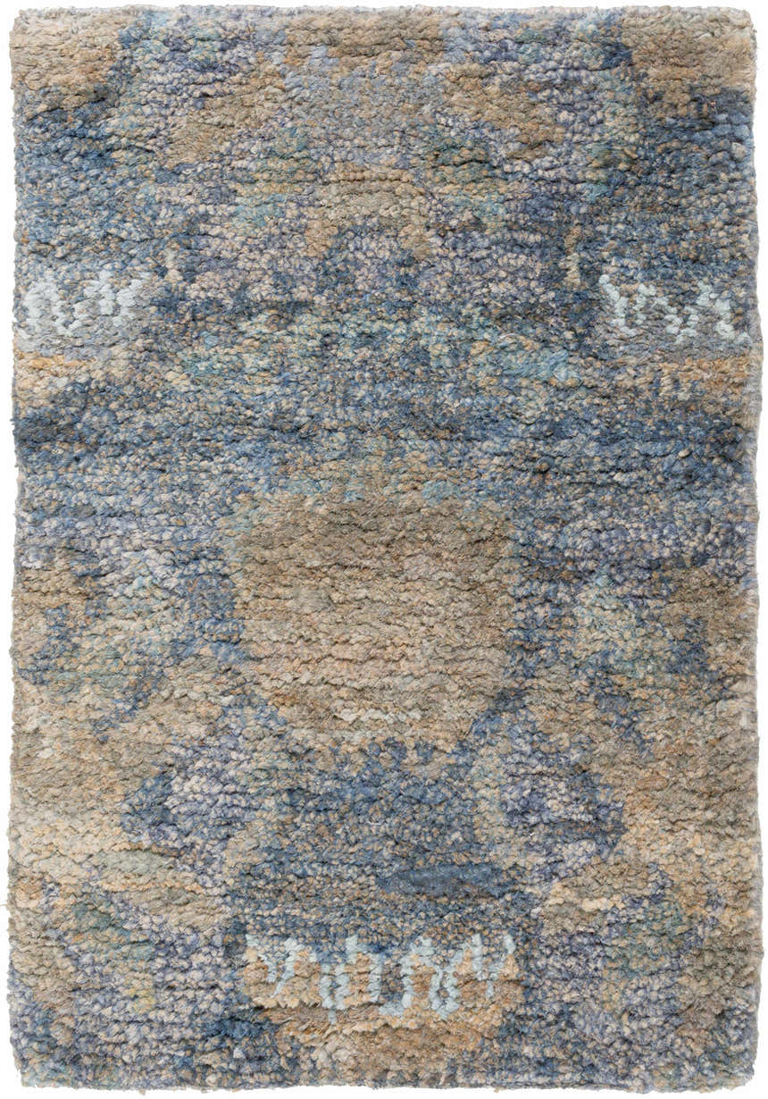 Close-up of the Bushong Jute Carpet. Hand-knotted rug in blue, brown, and white with a Southwestern-inspired pattern and textured feel. Design-Rectangle-23
