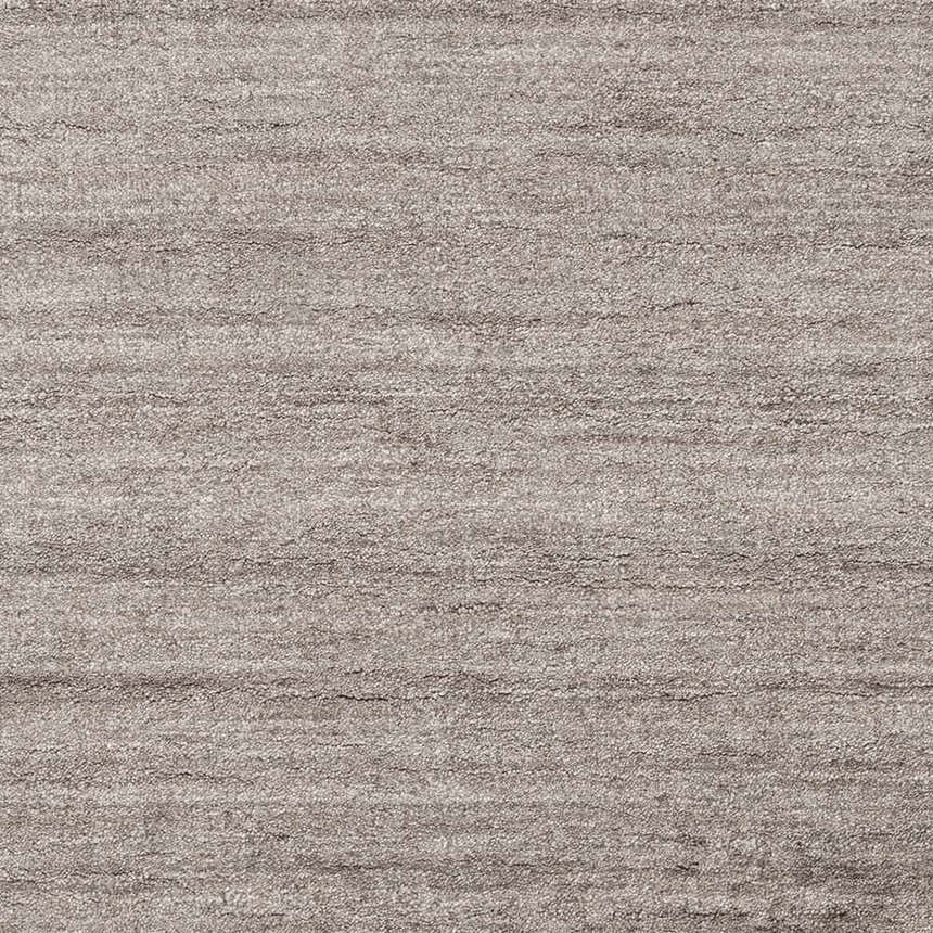 Close-up of the Buskirk Area Rug showing its subtle horizontal striations and soft, gray viscose texture. Swatch