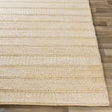 Close-up of the hand woven Bywong Area Rug. Beige and off-white jute rug with a farmhouse, transitional style. Front