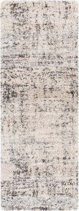 Close-up of the Calsib Area Rug. Shag rug in cream with black and light gray flecks, machine woven. Design-Runner-2773