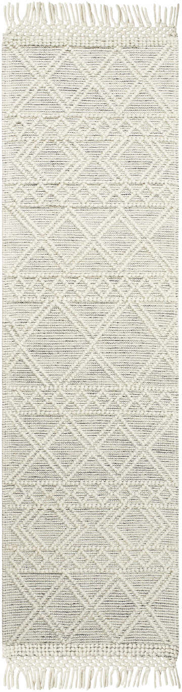 Close-up of Cameo Scandi Wool Rug in bone and gray with a geometric diamond pattern and fringe. Hand woven texture. Design-Runner-2376