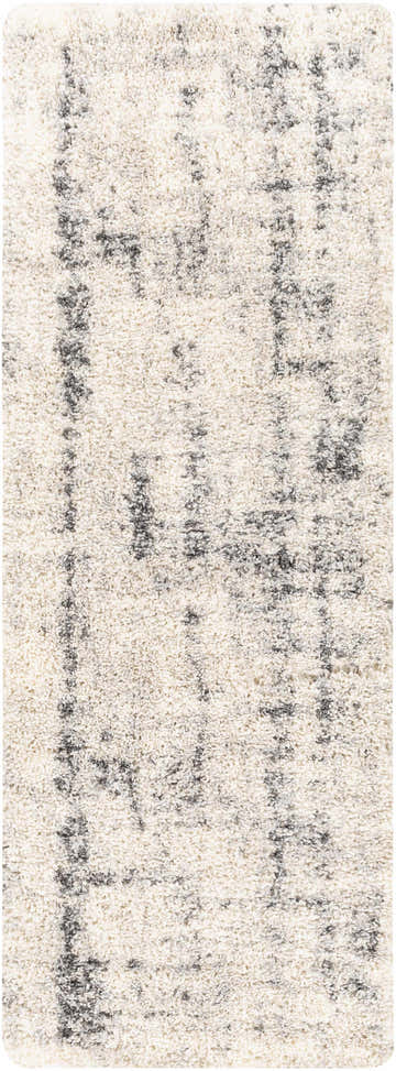 Close-up of the Campion Plush Cream Rug. Shag rug with a black, cream, and light beige contemporary design. Design-Runner-2710