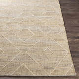 Close-up of the beige Carine Jute Area Rug showing its hand-woven texture and diamond pattern on a dark wood floor. Front