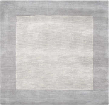 Close-up of a hand-loomed Bordered Solid Gray Wool Rug showing the charcoal border and soft, textured center. Design-Square-8