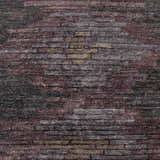 Close-up of the Cherokee Carpet, a hand-knotted rug in charcoal, gray, olive, lilac, and plum hues with a contemporary pattern. Swatch