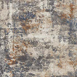 Close-up of the Chetwynd Abstract Thick Rug, featuring a distressed pattern in blue, brown, cream, and gray tones. Swatch