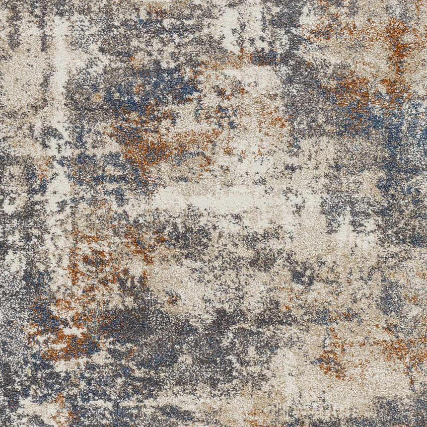 Close-up of the Chetwynd Abstract Thick Rug, featuring a distressed pattern in blue, brown, cream, and gray tones. Swatch