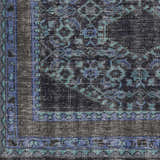 Close up of the Chesham Clearance Rug showing its dark blue, teal, and charcoal traditional pattern. Swatch
