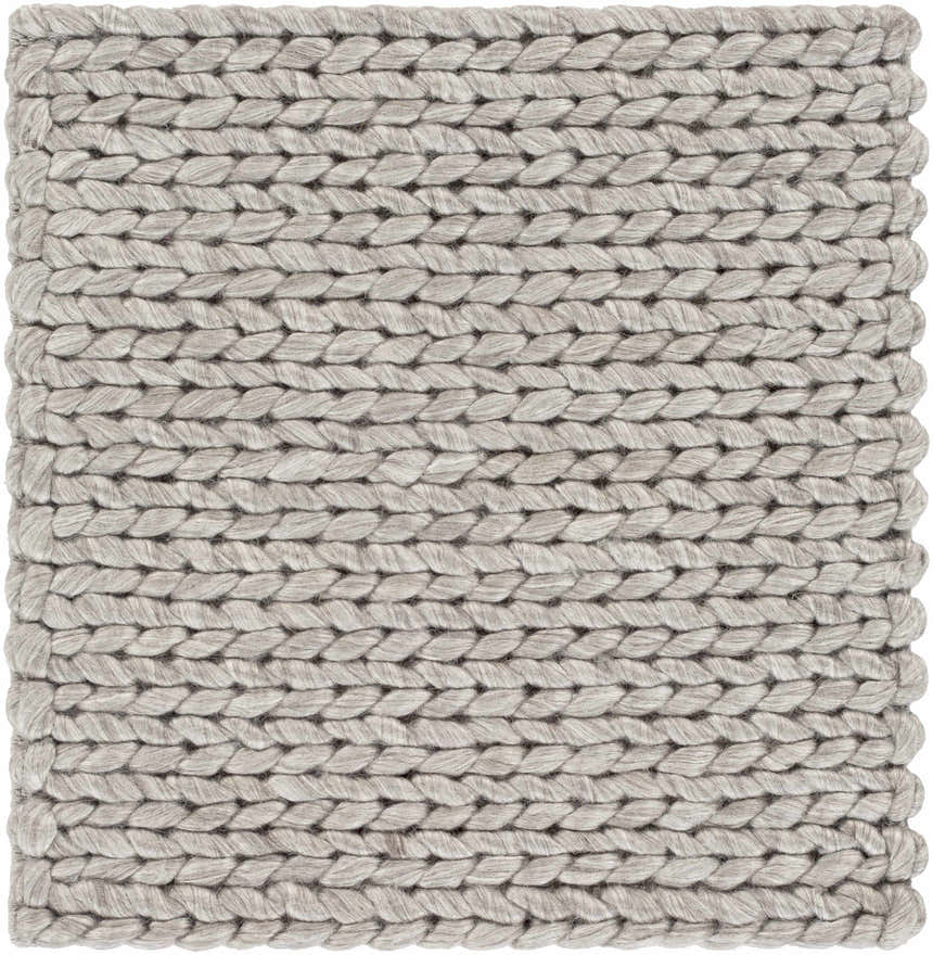 Close-up of the hand woven Cirencester Area Rug. Ivory and medium gray wool and viscose blend with a braided texture. Swatch