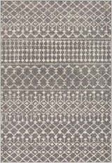 Close-up of the Cliffwood Area Rug. Charcoal gray rug with light beige geometric diamond and stripe pattern. Design-Rectangle-5373