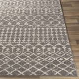 Close-up of the Cliffwood Area Rug. Charcoal, gray and light beige geometric pattern on a machine woven, rectangular rug. Front
