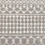 Close up of the Cliffwood Area Rug. Gray and light beige geometric pattern. Machine woven polypropylene texture. Swatch
