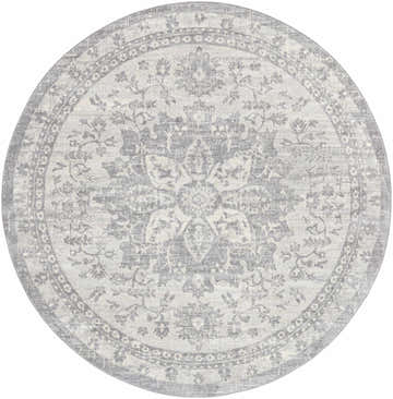Close-up of a round Colonie Area Rug. Gray, ivory, and silver gray tones with a traditional floral medallion pattern. Design-Round-710