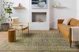 Living room scene with a brown leather sofa and the green and beige Clunes Area Rug. Roomscene-Rectangle