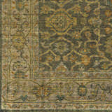 Close-up of the Clunes Area Rug. Hand-knotted wool rug in black, brown, grass green, light beige, sage, and yellow. Floral pattern. Swatch