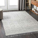Entryway with Gray Clintwood Wool Tassel Carpet, dark wood floors, gray curtains, and wood console table. Roomscene-Rectangle