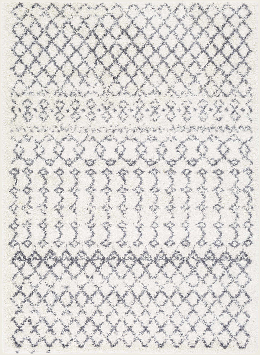 Close-up of the Clarkia Area Rug: a shag rug with a geometric diamond pattern in gray and white. Design-Rectangle-5373