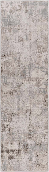 Close-up of the Calvinia Area Rug featuring a contemporary charcoal, gray, and light gray abstract design. Design-Runner