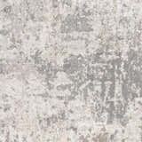 Close-up of the contemporary Calvinia Area Rug. Charcoal, gray, and light gray abstract pattern. Swatch