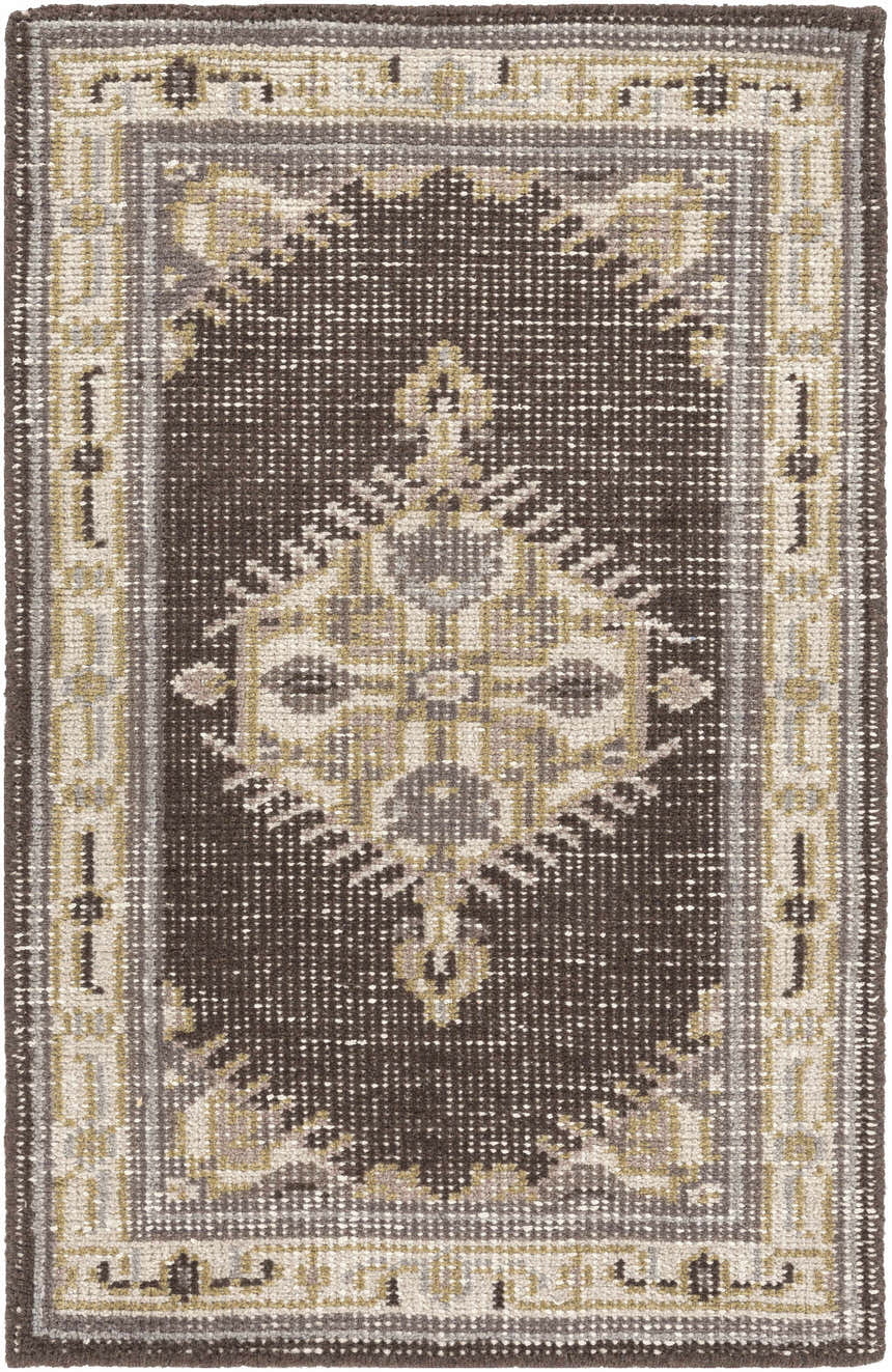 Top-down view of the Clyo Carpet, a hand-knotted wool rug in brown, gray, and off-white with a traditional pattern. Design-Rectangle-23
