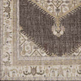 Close-up of brown and off-white Clyo Carpet with traditional floral and geometric patterns. Swatch