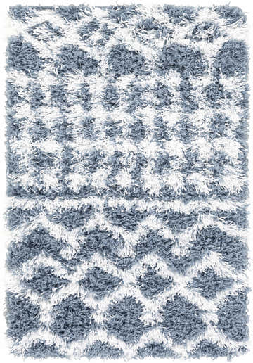 Close-up of the Camp Shag Area Rug, a denim and white shag rug with a geometric pattern. Soft, plush texture. Design-Rectangle-23