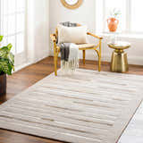 Living room scene with light beige Cantu Premium Viscose&Leather Area Rug, gold chair, and side table. Roomscene-Rectangle