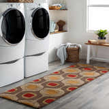 Laundry room scene with a brown, red, and tan Canovanas Modern Wool Rug on gray wood-look tile flooring. Roomscene-Runner