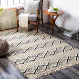 Farmhouse living room scene with a cream and black geometric Cobourg Area Carpet. Roomscene-Rectangle