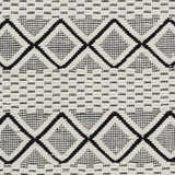 Close-up of the Cobourg Area Carpet. Black geometric diamonds on a cream, hand-woven wool rug. Contemporary farmhouse style. Swatch