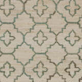 Close-up of Coffeyville rug. Cream jute carpet with a sage and ivory geometric pattern. Handcrafted, fringed texture. Swatch