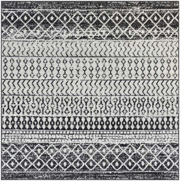 Close-up of the Constantin Area Rug. Black, gray, and white rug with a bohemian inspired geometric pattern. Design-Square-67