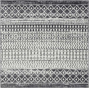 Close-up of the Constantin Area Rug. Black, gray, and white rug with a bohemian-inspired geometric pattern. Design-Square-6