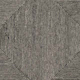 Close-up of the hand-tufted Conshohocken Area Rug. Black and cream wool rug with a geometric Moroccan-inspired pattern. Swatch