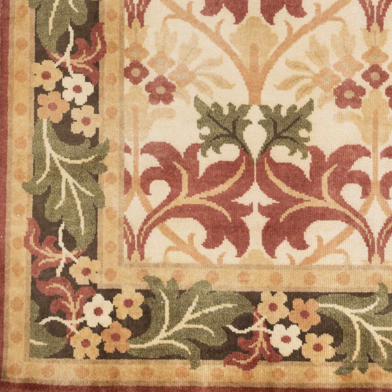 Close-up of the hand-knotted Corbridge Area Carpet. Features black, burgundy, and olive floral and leaf pattern on light beige wool. Swatch