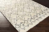 Close-up of the Cotgrave 2x3 Cream Trellis Wool Rug showing its shag texture and geometric trellis pattern. Corner