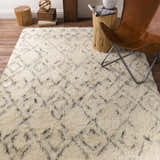 Living room scene with a cream shag Cotgrave rug, leather chair, and rustic wood accents. Styleshot